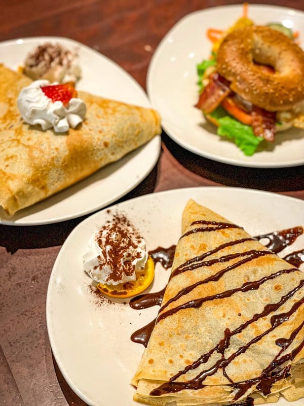 A spread of food, including crepes, at Le Casse-Crêpe Breton.
