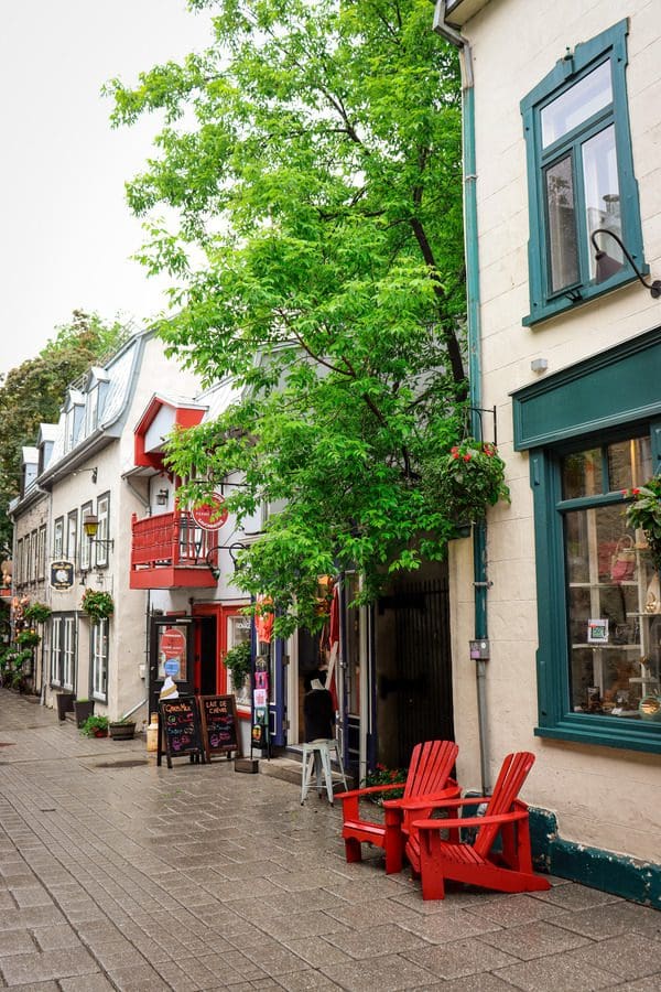 Shops along a stone street in the Petit Champlain Quarter, a must see on any Quebec City itinerary with kids.