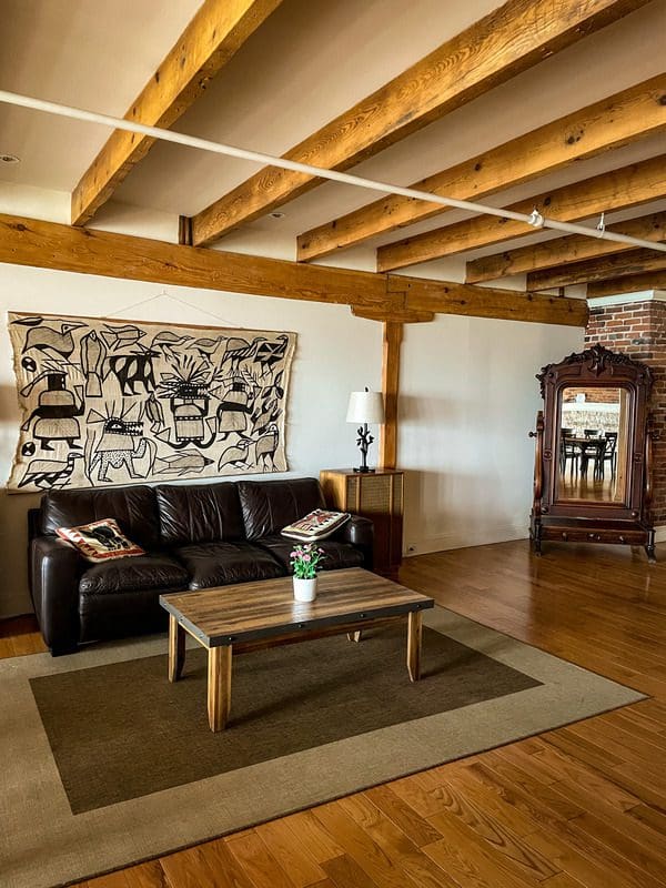 The living room area of Royal Dalhousie, featuring a couch and large mirror.