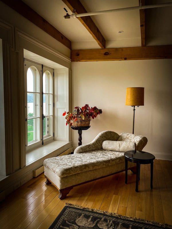 A fainting couch nestled along the windows of an apartment at Royal Dalhousie, a a great place to stay for any Quebec City itinerary with kids.