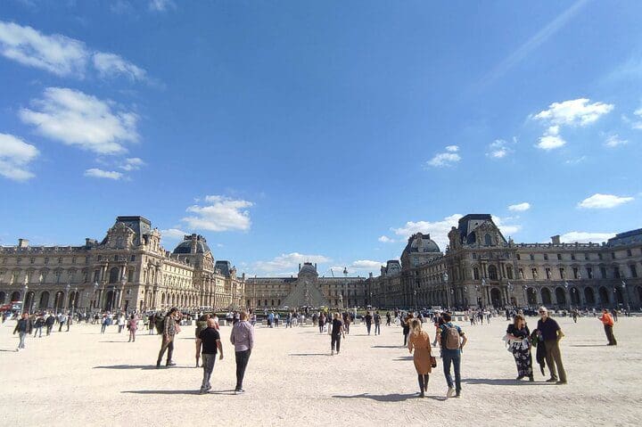 People exploring the grounds of the Louvre, while on the Louvre Highlights Tour for Kids with Skip The Ticket Line.