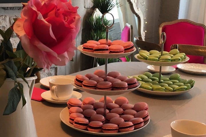 A table filled with different types of macarons.