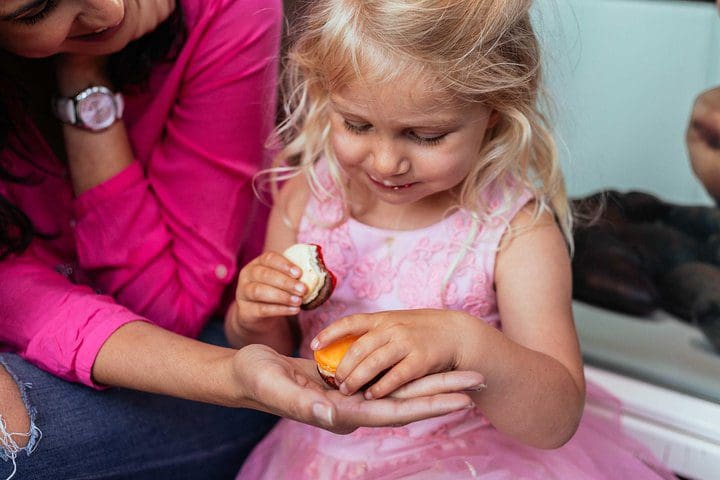 A young girl enjoys a treat on the Paris's Flavors: Customized Food Tour for the Whole Family .