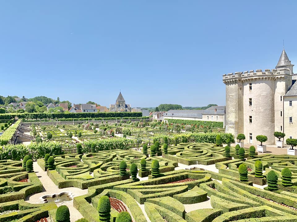 An aerial view of a beautiful hedge maze behind Chateau de Villandry in the Loire Valley, one of the best places to visit in France with kids.