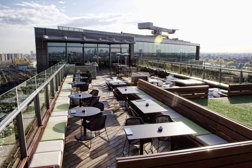 The rooftop terrace of DoubleTree by Hilton Amsterdam Centraal Station, overlooking the city.