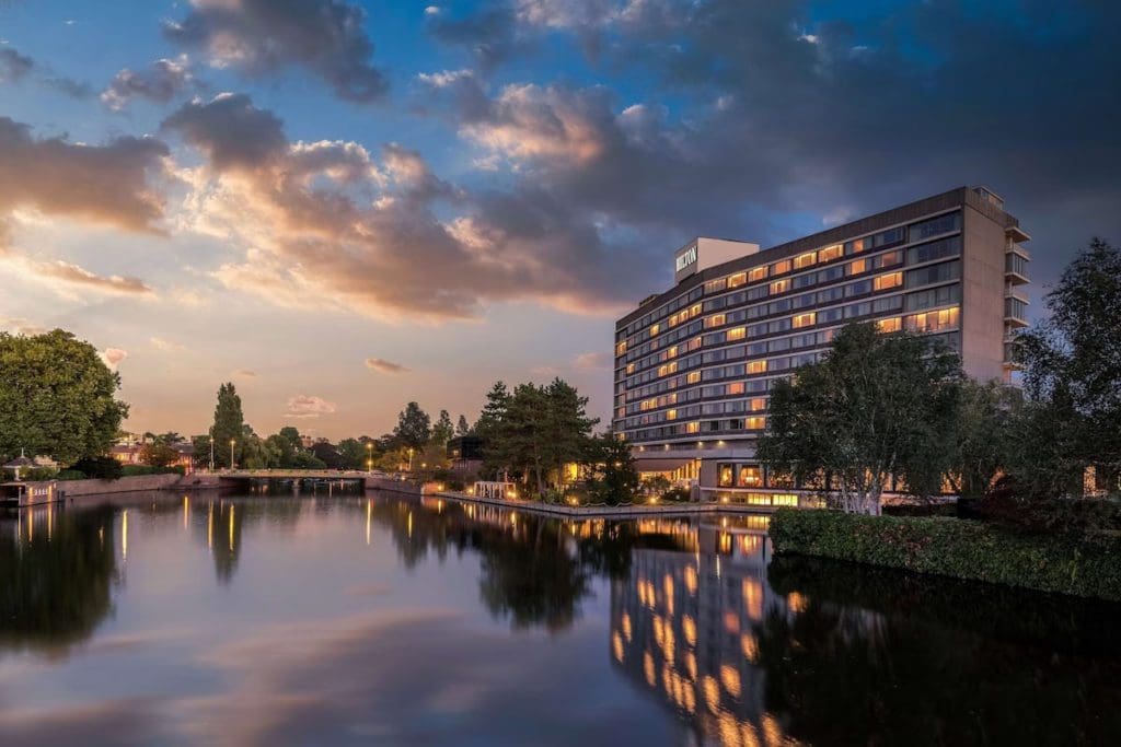 The exterior of Hilton Amsterdam at dusk.