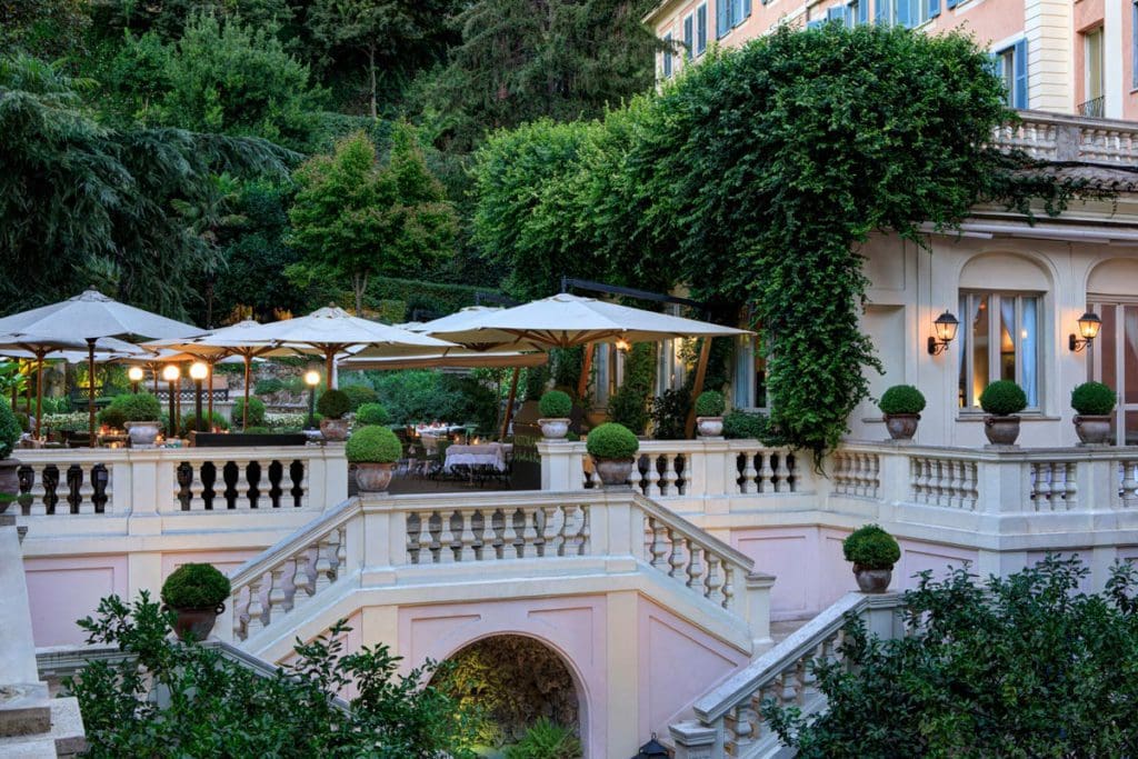 A lovely balcony and the exterior entrance area to Hotel de Russie, one of the best Rome hotels for families.