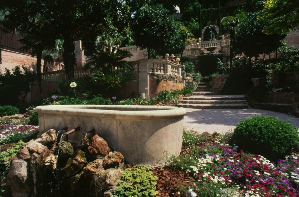 A lush outdoor garden area at Hotel de Russie.