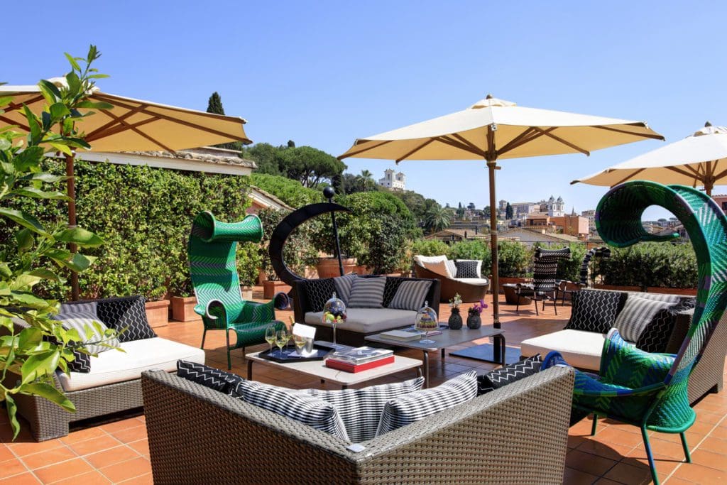 The outdoor terrace at Hotel de Russie on a sunny day.