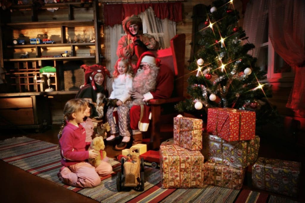 Several kids visiting Santa at Kakslauttanen Arctic Resort.