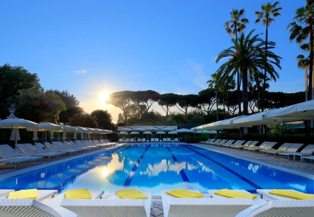 The outdoor pool and pool deck at Parco dei Principi Grand Hotel & SPA.
