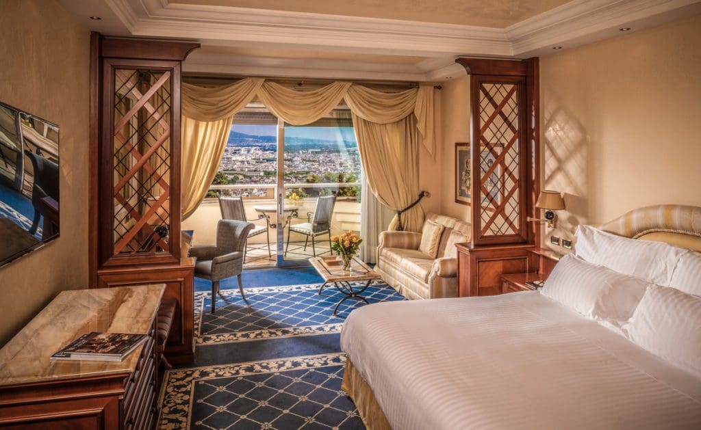 A lovely guest room in Rome Cavalieri, a Waldorf Astoria Hotel, one of the best Rome hotels for families.