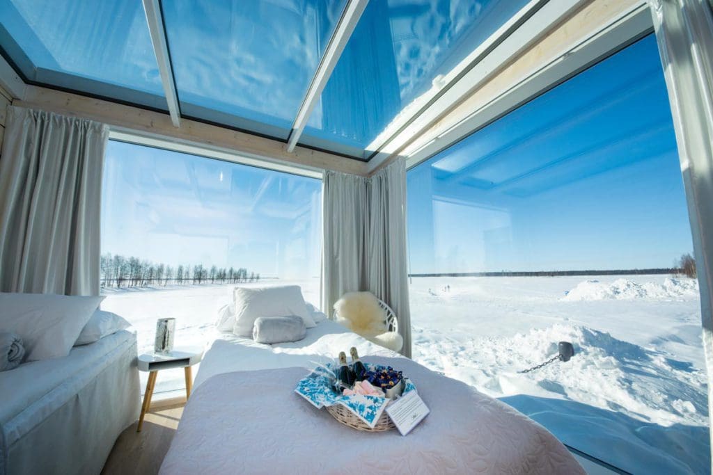 Inside one of the cabins at Seaside Glass Villas, with a wintery view outside the large windows.