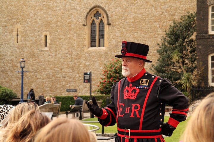 A tour guid leads a tour about the Royals in London.