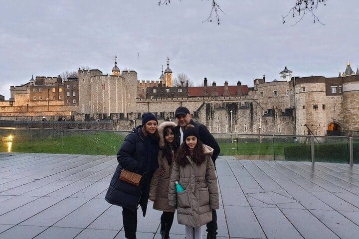 A family stands together while on a private tour of London with Tripadvisor.