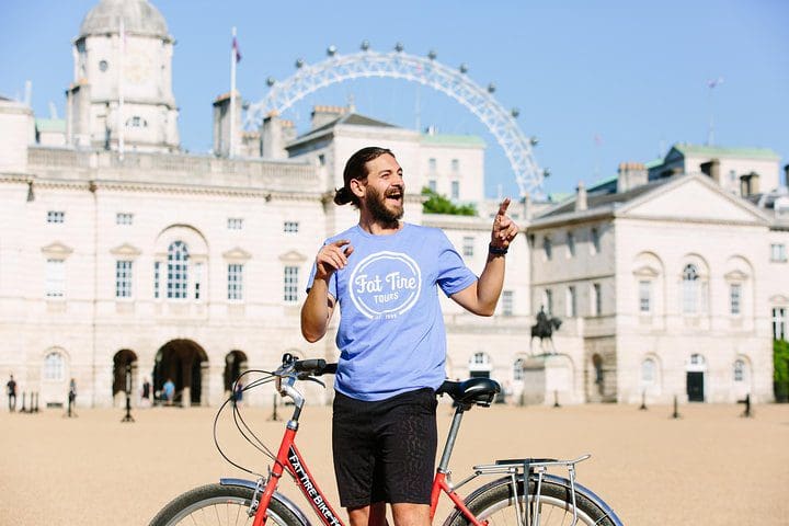 A Fat Tire Tours guide leads a discussion while showing people around the Royal Parks of London.