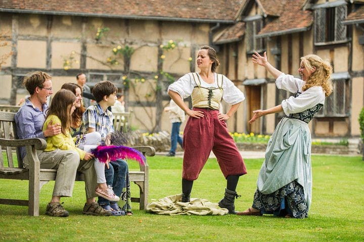 A family watching a Shakespeares in Stratford upon Avon.