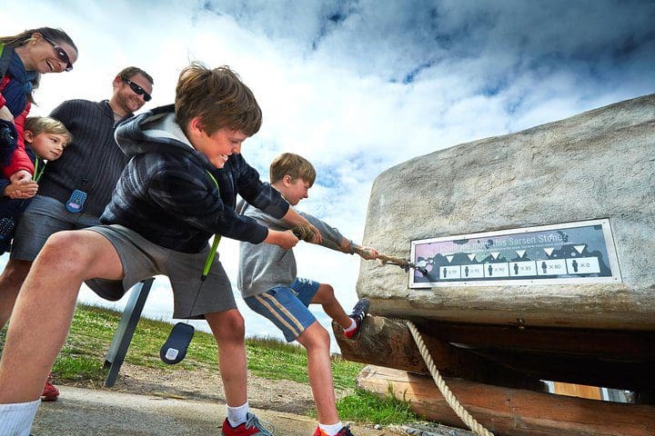 A family engages in an activity while on a tour with Tripadvisor near London.