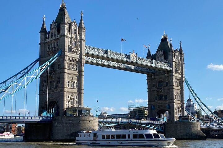 A tour boat moves past the Tower of London.