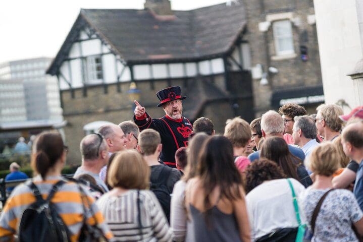 A tour guide discusses the British crown jewels while giving a private tour.