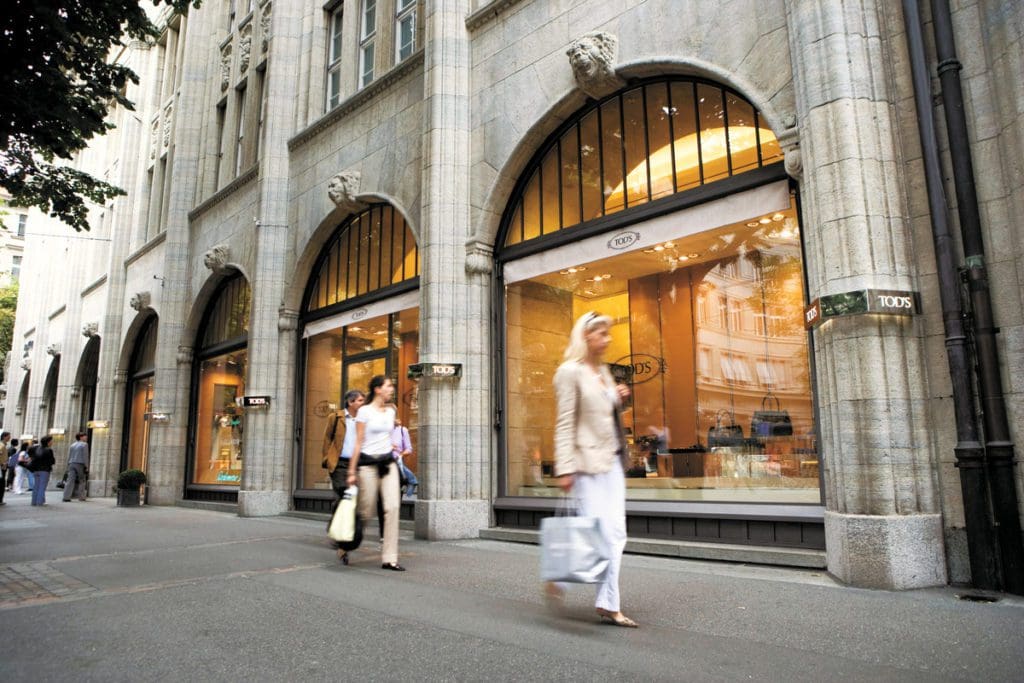 People walk along a street in Bahnhofstrasse, one of the best shopping districts in Zurich.