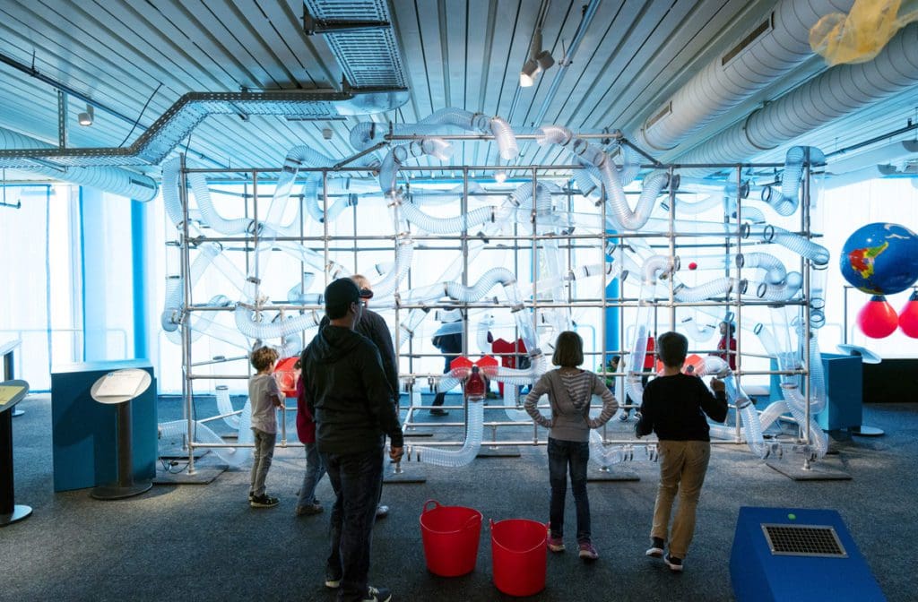 Several kids look at an exhibit at Technorama Science Centre.