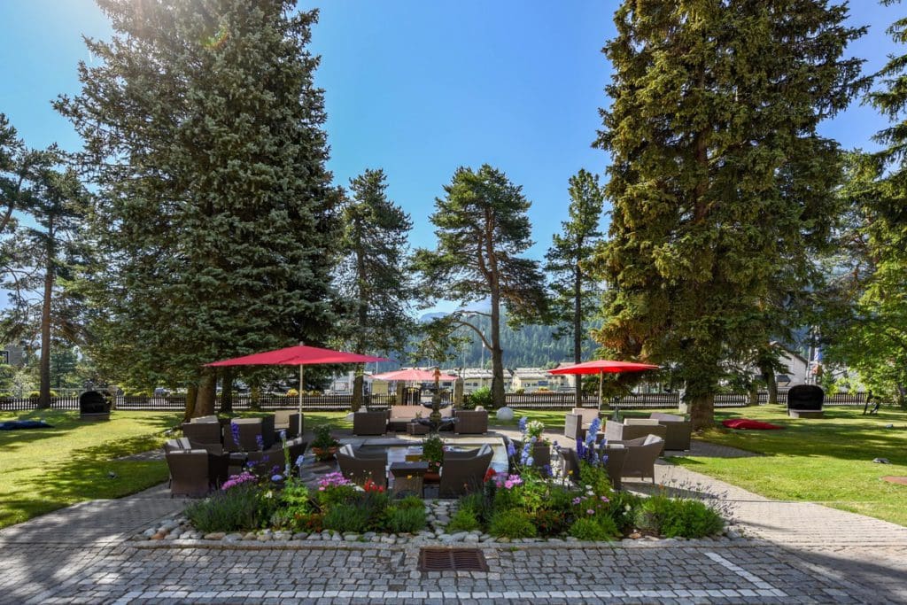 Outside in the garden of Cresta Palace Hotel, one of the best hotels near St. Moritz for families.