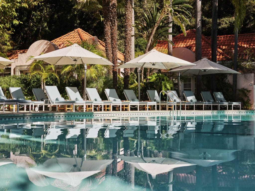 The serene outdoor pool, with poolside loungers, at Hotel Bel-Air.