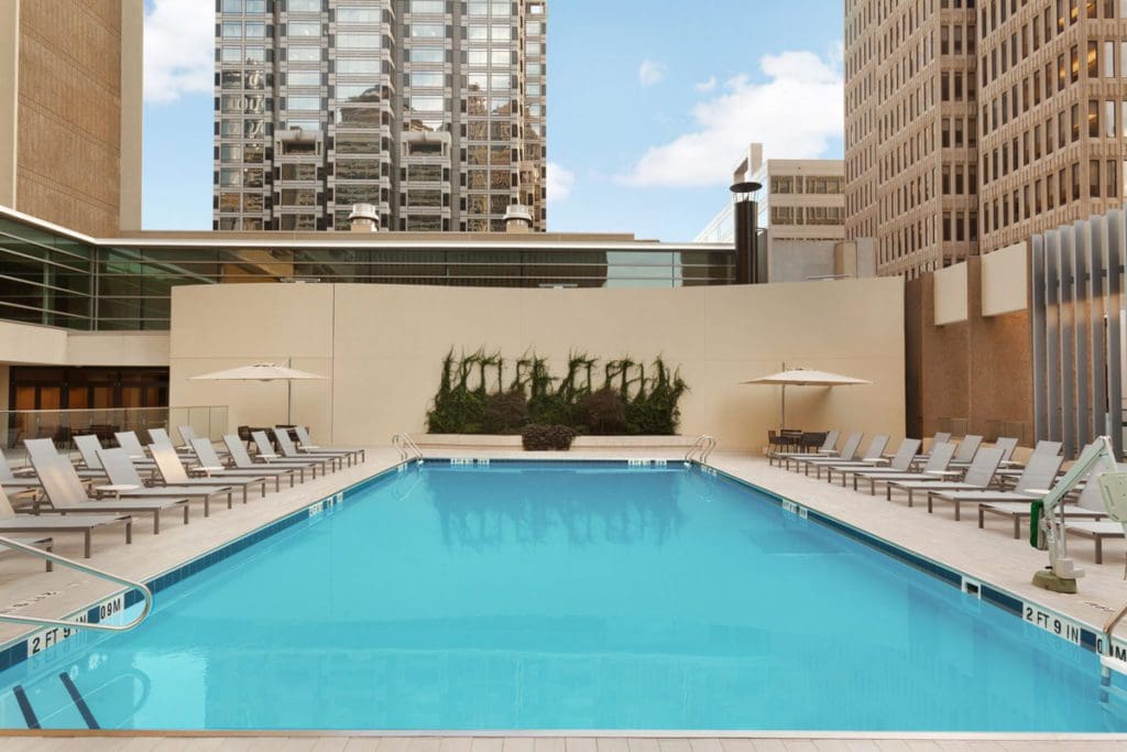 The outdoor rooftop pool and surrounding pool deck at Hyatt Regency Atlanta.