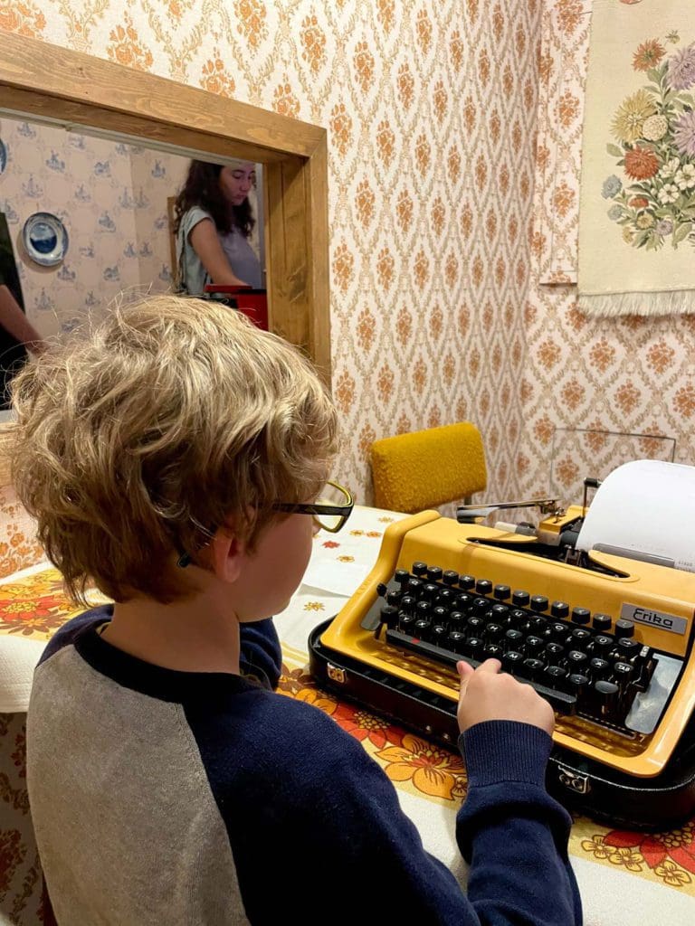 A young boy interacts with an exhibit at the DDR Museum.