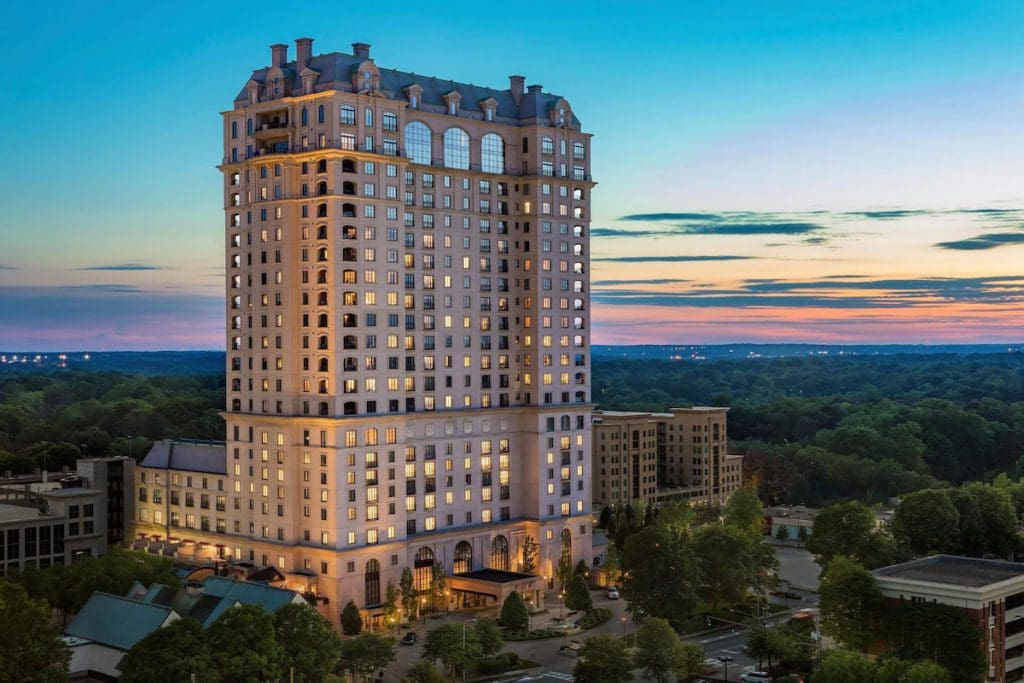 The exterior of The St. Regis Atlanta at dusk.