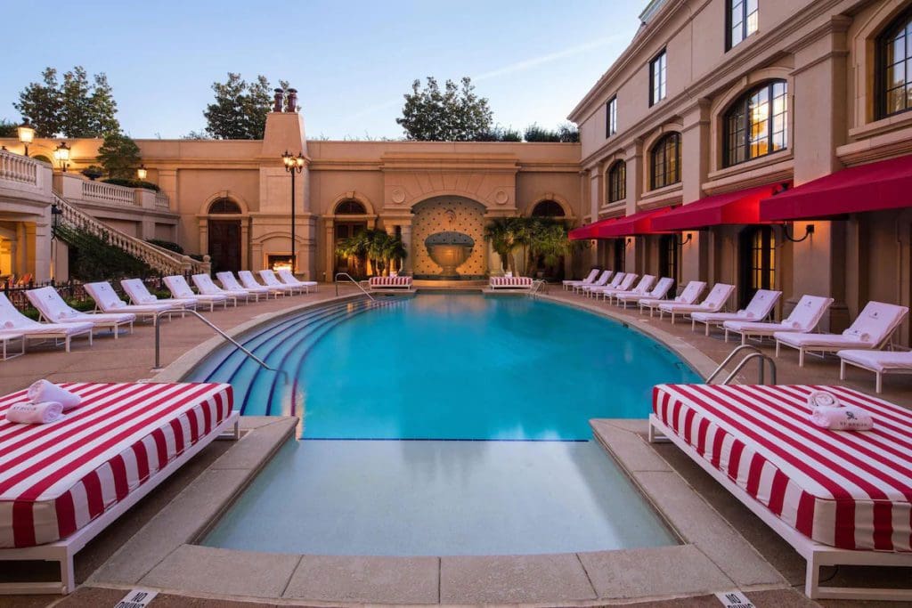 The outdoor pool and surrounding pool deck at The St. Regis Atlanta.