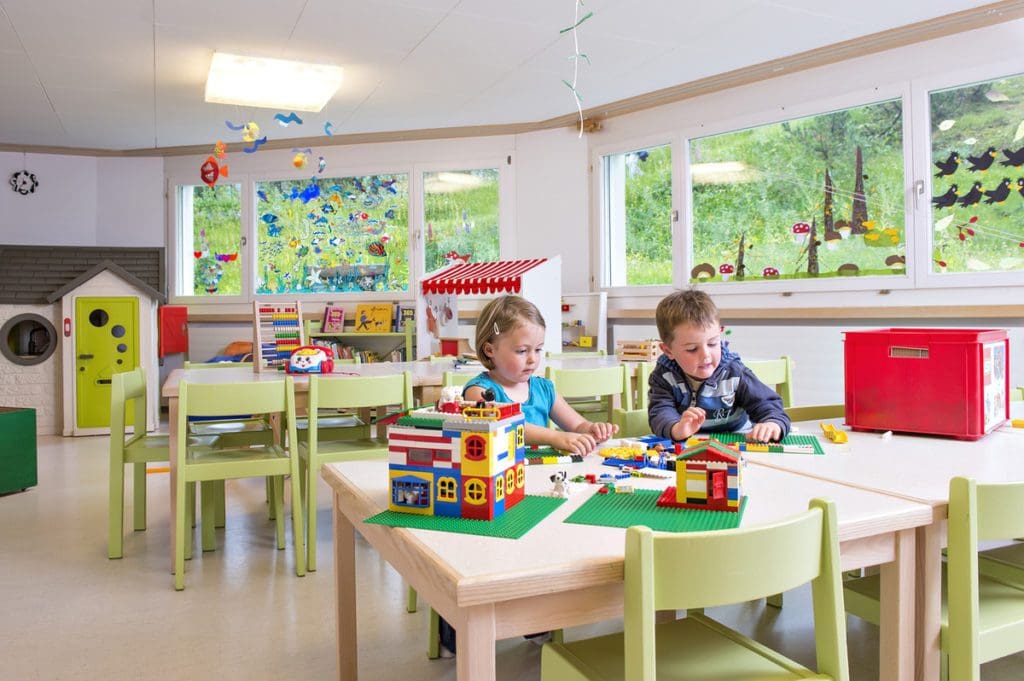 Two kids play in the kids' club at Waldhaus Sils.