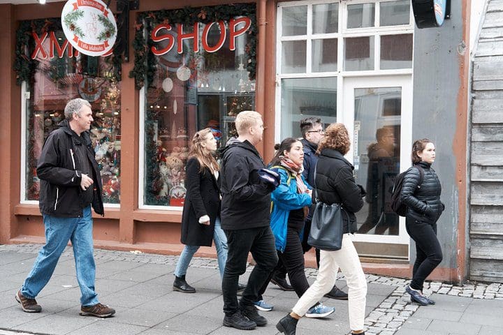 A group of people explore Iceland on the Funky History Walking Tour With Local Storyteller - With Hot Dog.