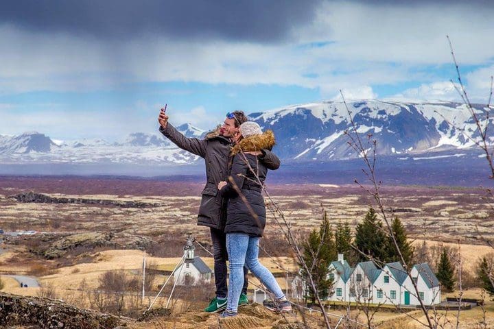 A couple takes a selfie, while on the Golden , one of the best Iceland tours with kids.Circle Full Day Tour from Reykjavik by Minibus