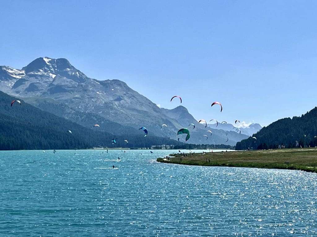 Several people kite surfing on Lake Photo Courtesy: Gunjan Prakash.