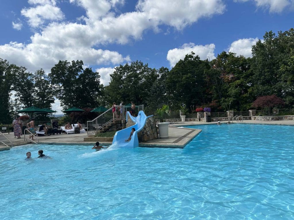 A outdoor pool and playground at Nemacolin Resort.