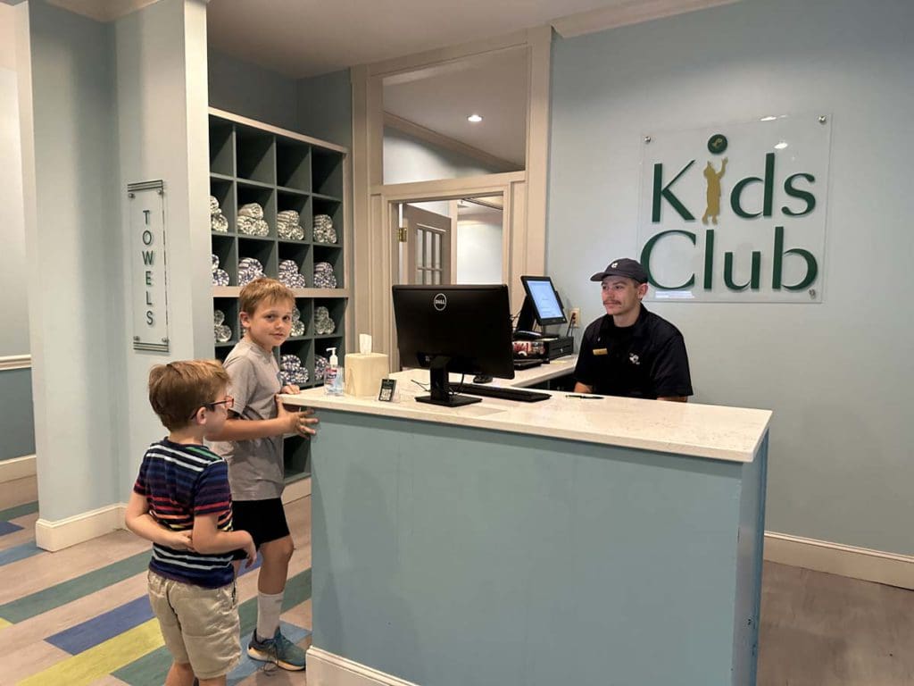 Two kids check in at the kids' club at Nemacolin Resort.