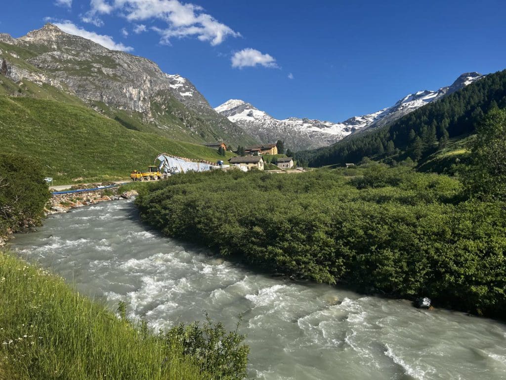 A river running through a scenic part of the Val Fex Valley.