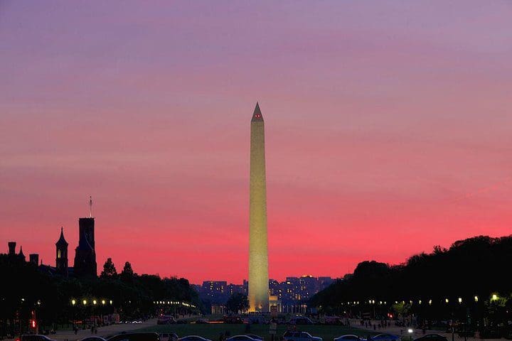 The Washington Monument at sunset, as see on the Washington DC Monuments by Moonlight Tour by Trolley.