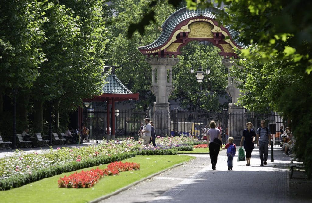 People walking around the entrance to Zoo Berlin.