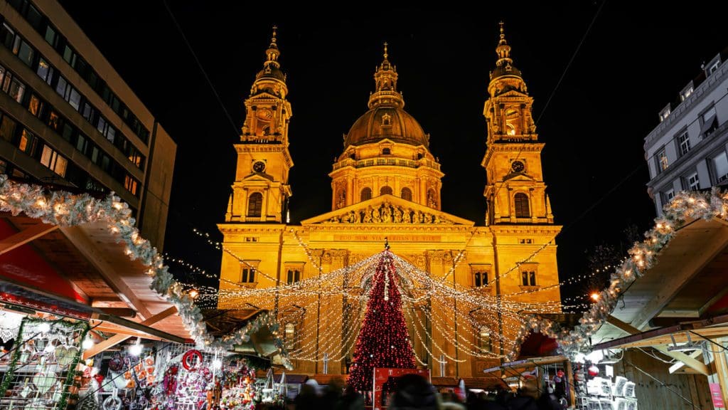 A Christmas market in the center of Budapest, lit up with lights, one of the best places for Christmas for families in the world.