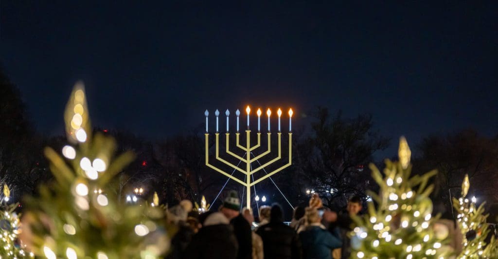 A large menorah lit of Chanukah in Washington DC, one of the best budget-friendly holiday destinations in the US for families.