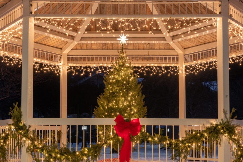 A lit Christmas tree in a gazebo in Door County, one of the best budget-friendly Christmas destinations in the US for families.
