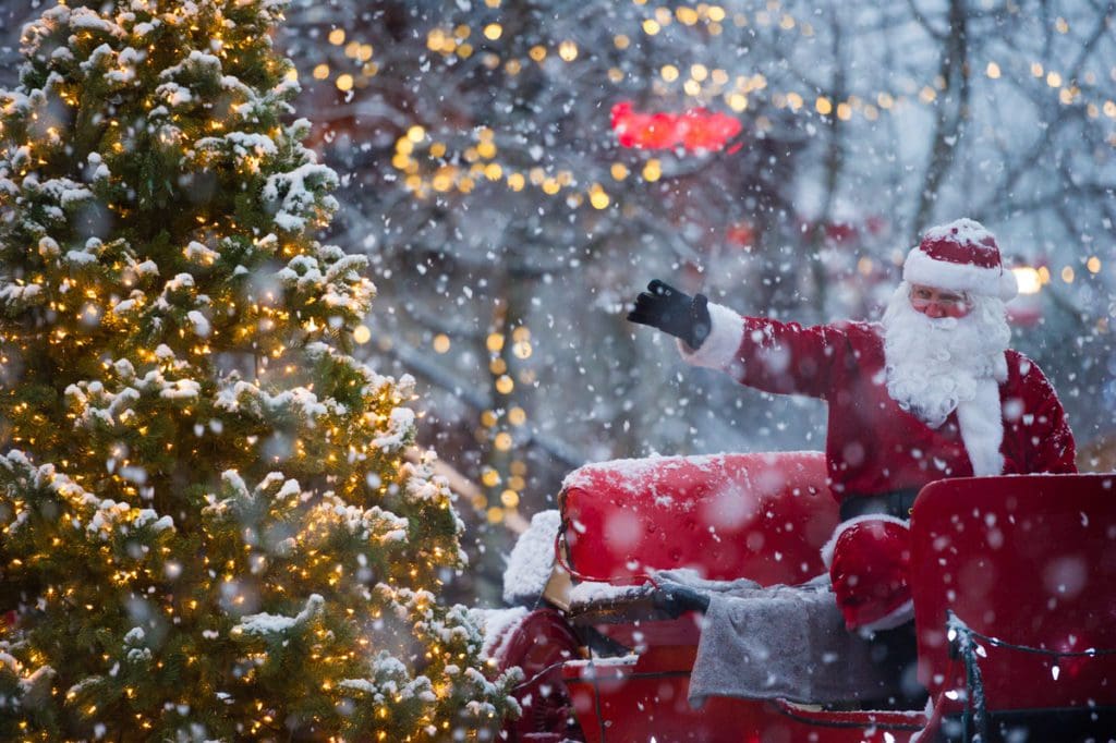 Santa waves from a parade float in Whistler.