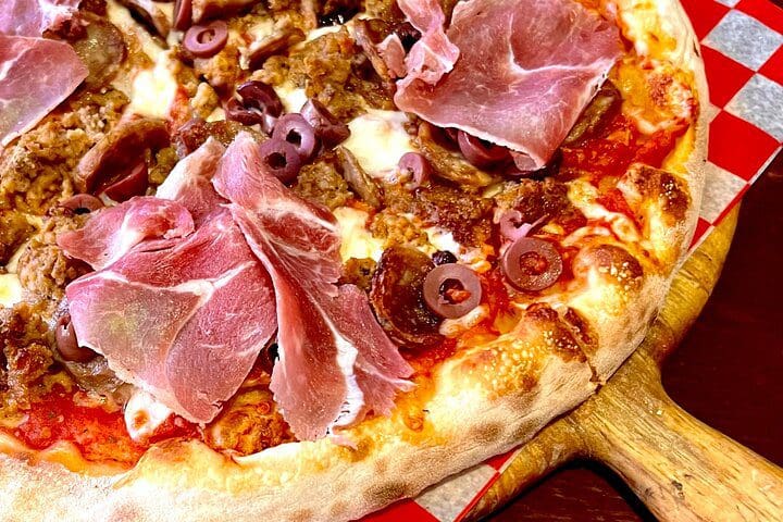 A close up of a pizza, as experienced on the New York Walking Food Tour With Secret Food Tours.