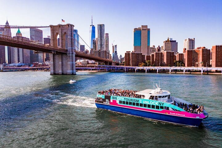 A boat moves down the Hudson River featuring the New York City Freedom Liberty Cruise.