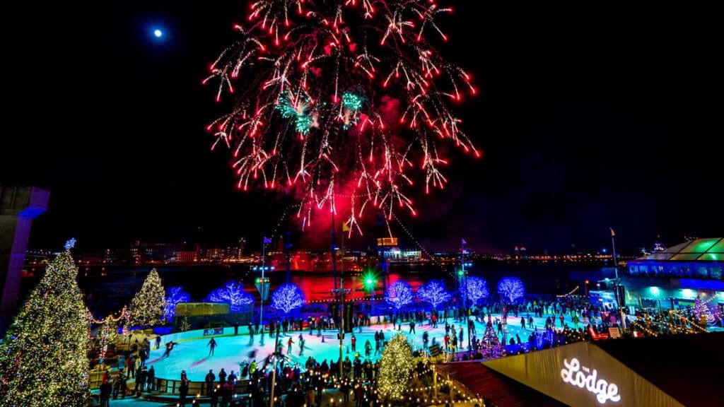 Fireworks celebrating the New Year over an outdoor skating rink in Philadelphia.