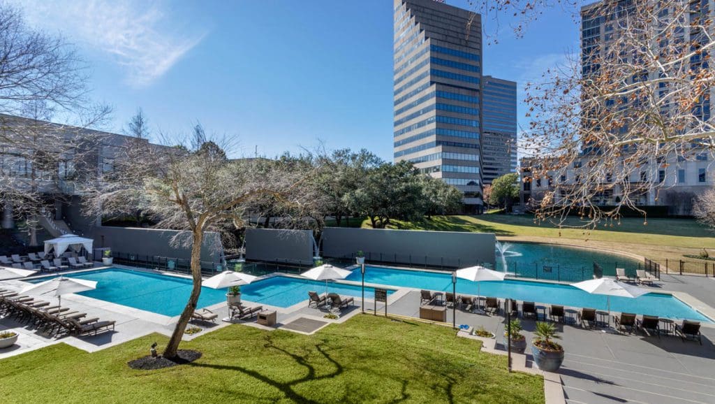 The outdoor pool and deck area at Omni Houston Hotel.