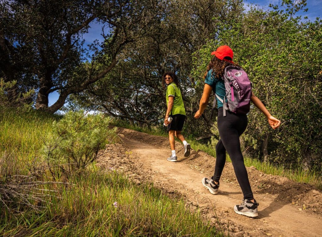 A couple hikes along a trail in Santa Maria Valley.